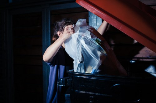 Workers managing construction debris for waste clearance